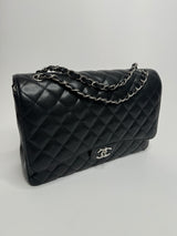 Chanel Maxi Classic Double Flap In Black Caviar With Silver Hardware